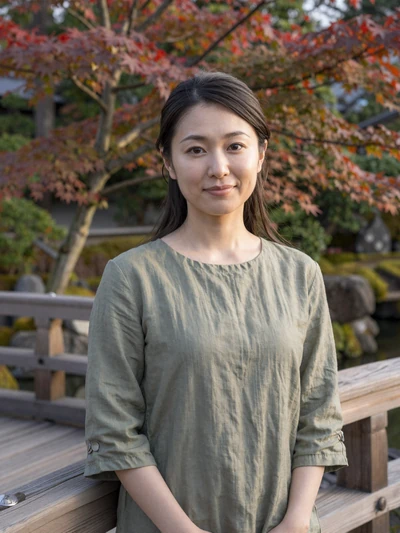 Kanako, 32-year-old Japanese woman from Kyoto on a garden bridge seeking committed partnership