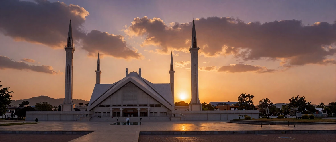 Faisal Mosque in Islamabad Pakistan at sunset with Margalla Hills in background