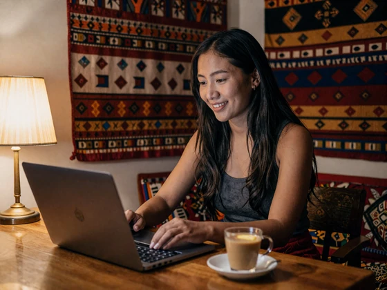 Bhutanese woman enjoying a video call with her match from a cozy room in Thimphu